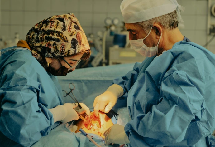 Surgeons perform an operation in the operating room.